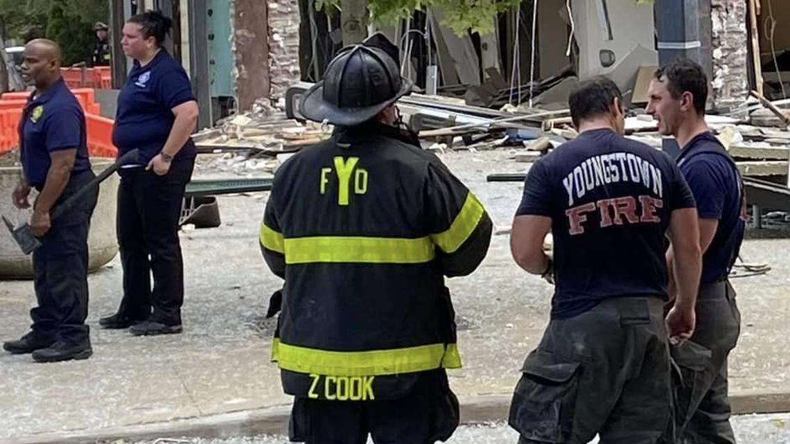Youngstown firefighters work at the scene of an explosion Tuesday in downtown Youngstown.