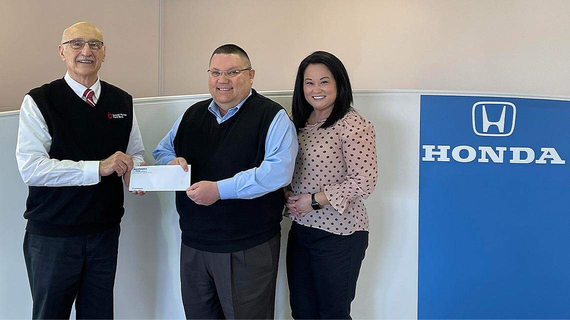 Apostolakis Honda recently presented Second Harvest Food Bank of the Mahoning Valley with a $1,000 check. From left are Mike Iberis, Second Harvest Food Bank of the Mahoning Valley executive director; John Apostolakis, Apostolakis Auto Group president; and Jess Briganti, Apostolakis Auto Group marketing director.