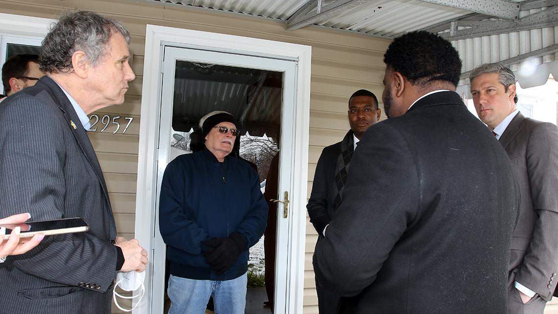 Bill Kuhley (second from left), a 20-year resident of Youngstown’s West Side, discusses upcoming, federally funded lead pipe replacement projects along Eddie Street with U.S. Sen. Sherrod Brown of Cleveland, D-Ohio (left); U.S. EPA Administrator Michael Regan (third from right); city Mayor Jamael Tito Brown (second from right); and U.S. Rep. Tim Ryan of Howland, D-13th (right).