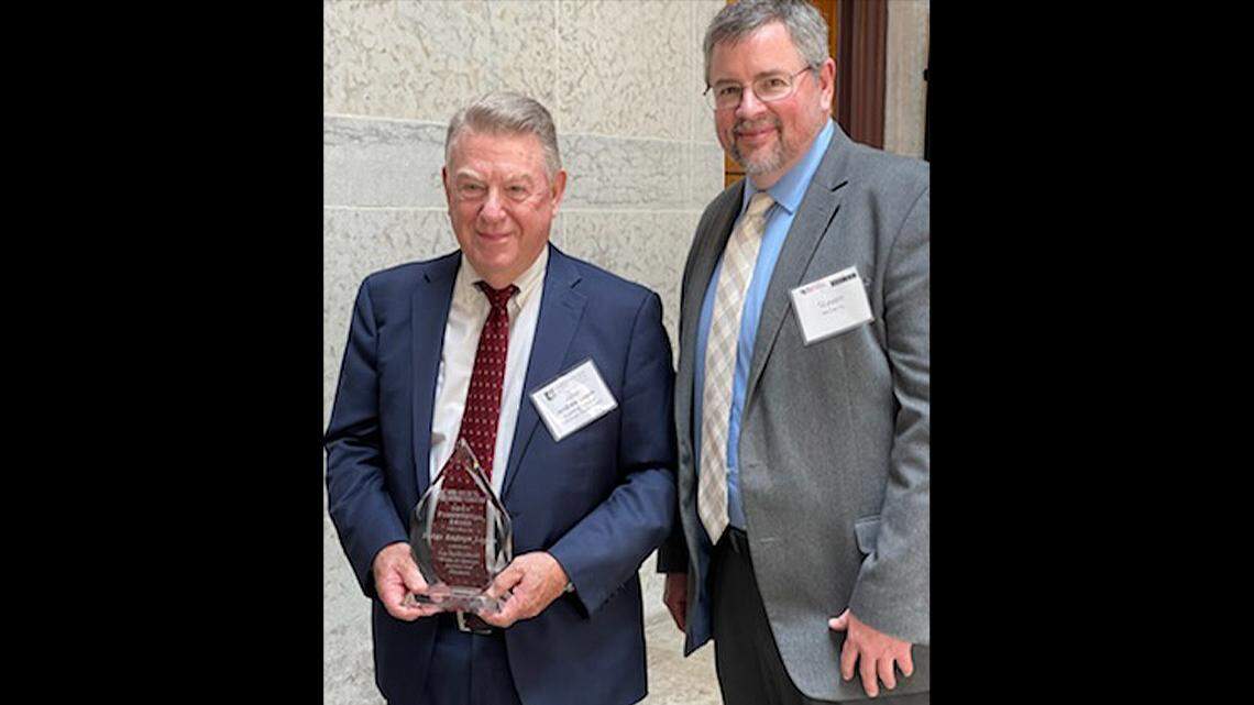 Judge Andrew Logan, left, of Trumbull County Common Pleas Court was awarded The Ohio Access to Justice Foundation’s Presidential Award for Pro Bono Service. At right is Steven McGarrity, executive director of Community Legal Aid.