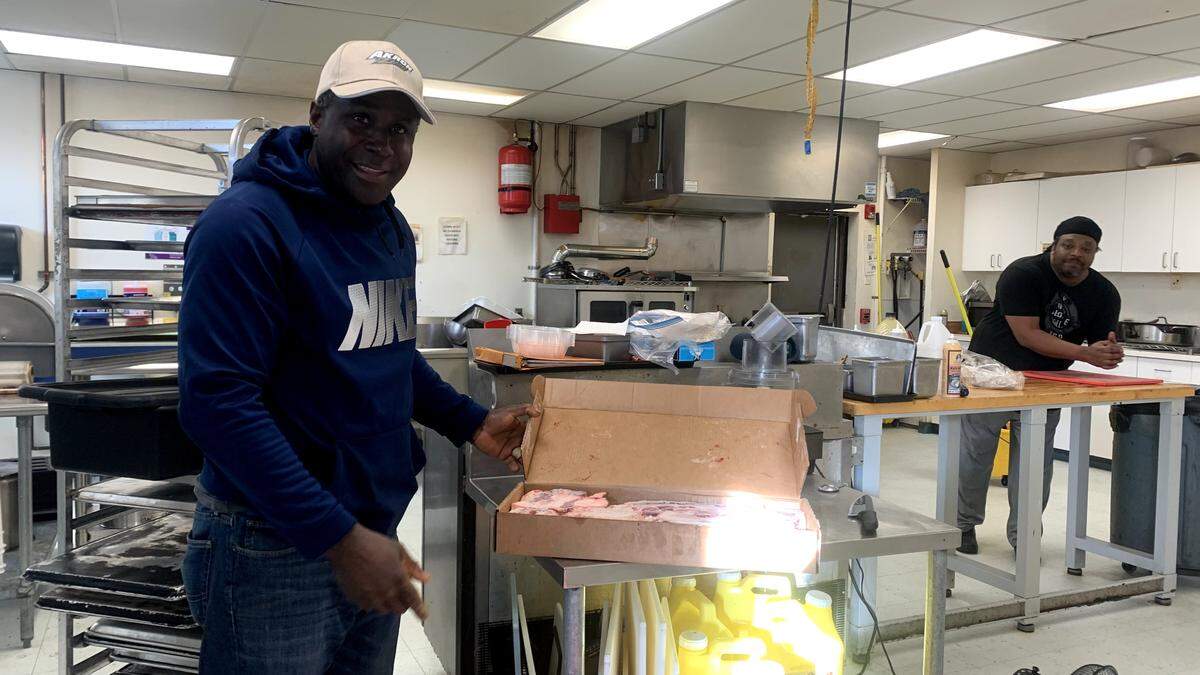 Inside the kitchen of Tebo’s Caribbean Cuisine with owner Gaeton Thompson.