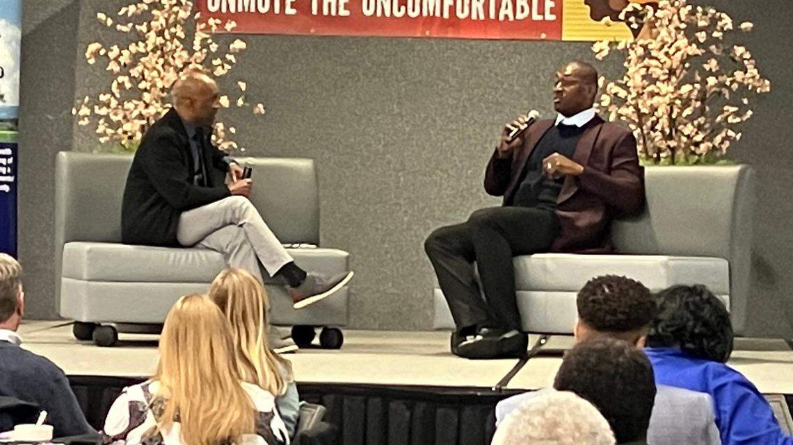 Former NBA star Metta World Peace, right, speaks with David Lee Morgan during the “Unmute the Uncomfortable 2023: A Symposium on Racial Equity, Shattering the Stigma, and Reshaping our Community” Thursday at Executive Event Center in Niles.