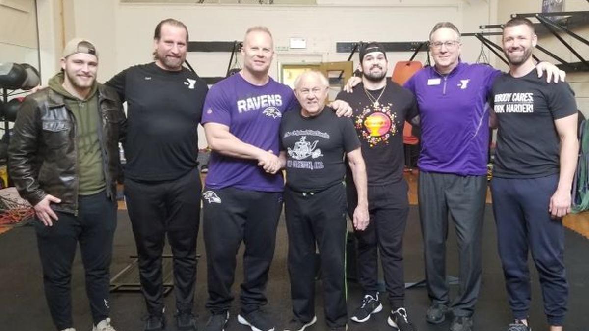 From left, Levi DeMarco, YMCA staff member; Carl LaRosa, YMCA fitness coordinator; Steve Saunders, Baltimore Ravens head strength and conditioning coach; Dick Hartzell, founder of Jump Stretch; Rob Beardman, YMCA staff member; Tom Gacse, YMCA CEO and president; and Scott Elliott, Ravens coaching analyst. (Contributed photo)