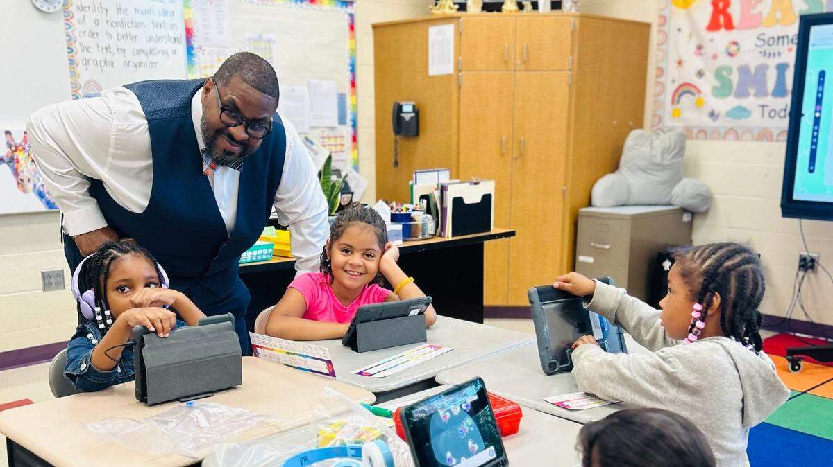 Superintendent Jeremy Batchelor meets with teachers and students during a visit throughout the Youngstown City School District for the first week back for fall.