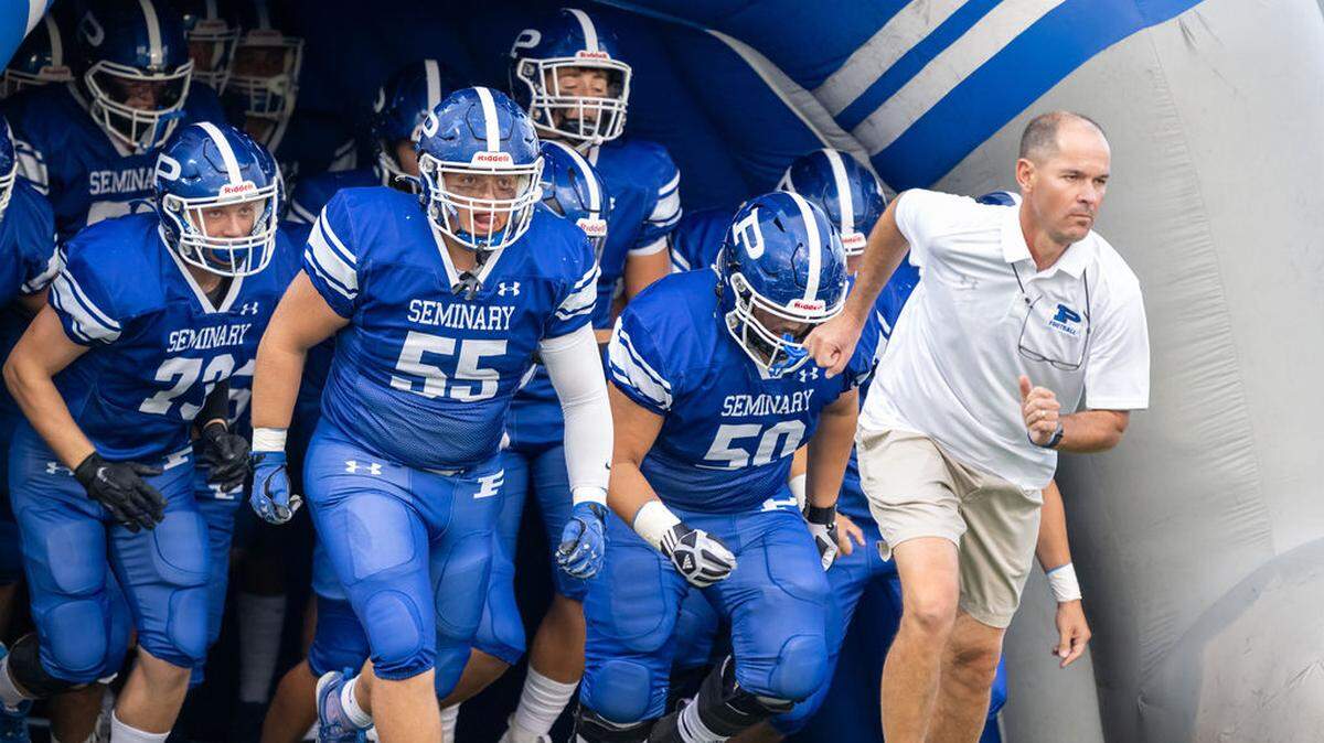 The Poland football team takes the field before Friday night’s game against Canfield. Poland won 10-7.