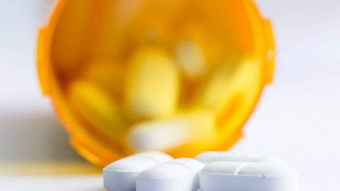 FILE Opioid tablets in bottle