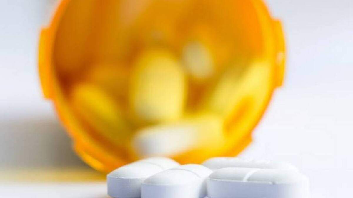 FILE Opioid tablets in bottle