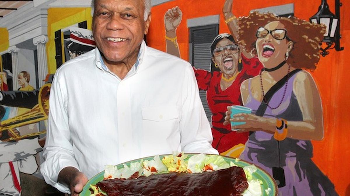 Charlie Staples, owner of Charlie Staples Famous Bar-B-Que holds a plate of BBQ ribs at his Youngstown eatery. William D. Lewis/Mahoning Matters 