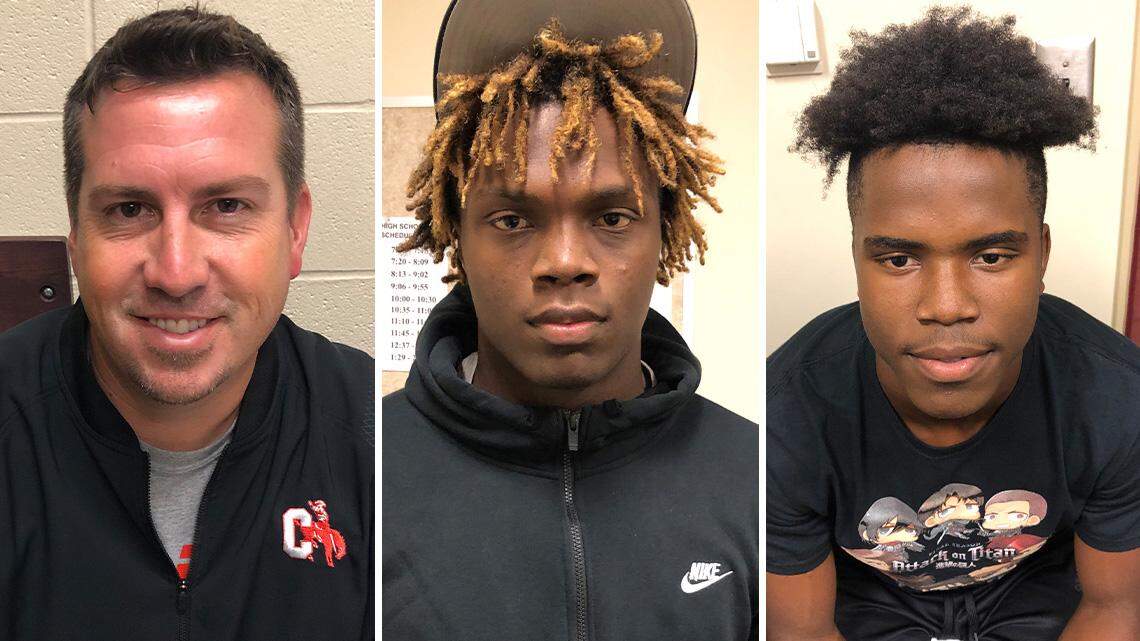 From left are Chaney High School football coach Seth Antram and seniors Jason Hewlett and Jaquan Johnson.