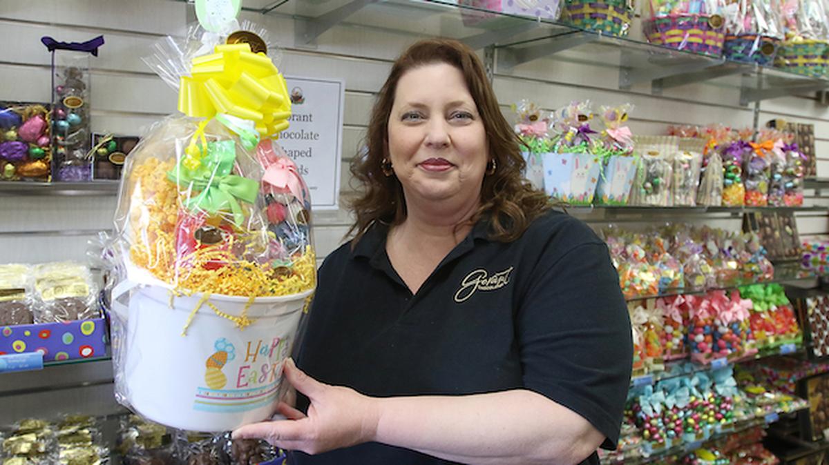 The Gorant Chocolatier candy company has been in the Valley for 71 years and is ready another Easter. Renee Thompson, store manager, shows off one of many baskets for sale. (Bob Yosay/Mahoning Matters)