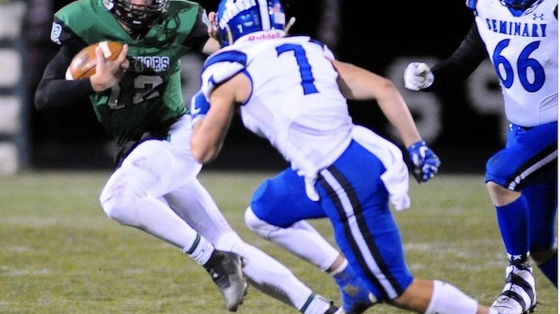 West Branch quarterback Dru DeShields, left, eludes Poland's Alex D"Angeo (7) and Brayden Pirone(66) in their Nov. 5 playoff game won by the Warriors. 