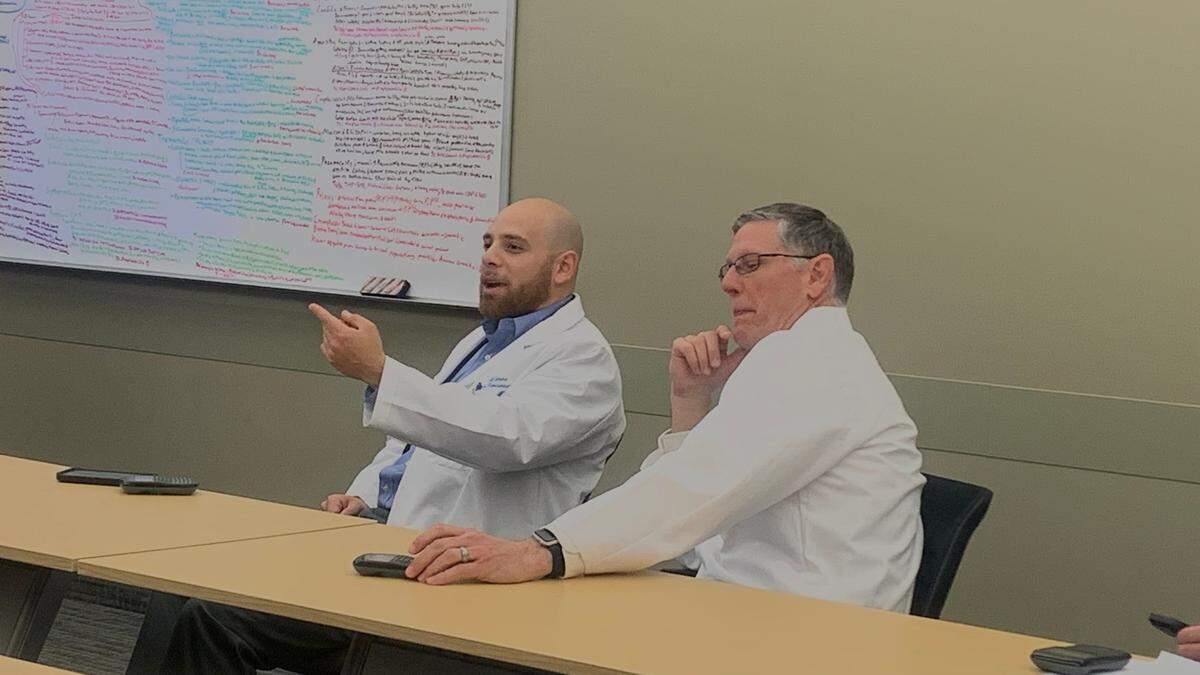Representatives Al Cutrona and Joseph Miller learning how NEOMED students participate in class through multiple-choice questions and peer instruction.&nbsp;