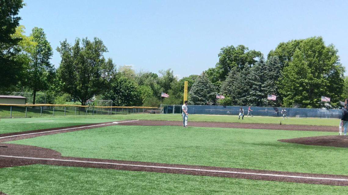 Salem High School players warm up prior to Monday’s Division II district semifinal game against Geneva at Louisville’s Field of Dreams.