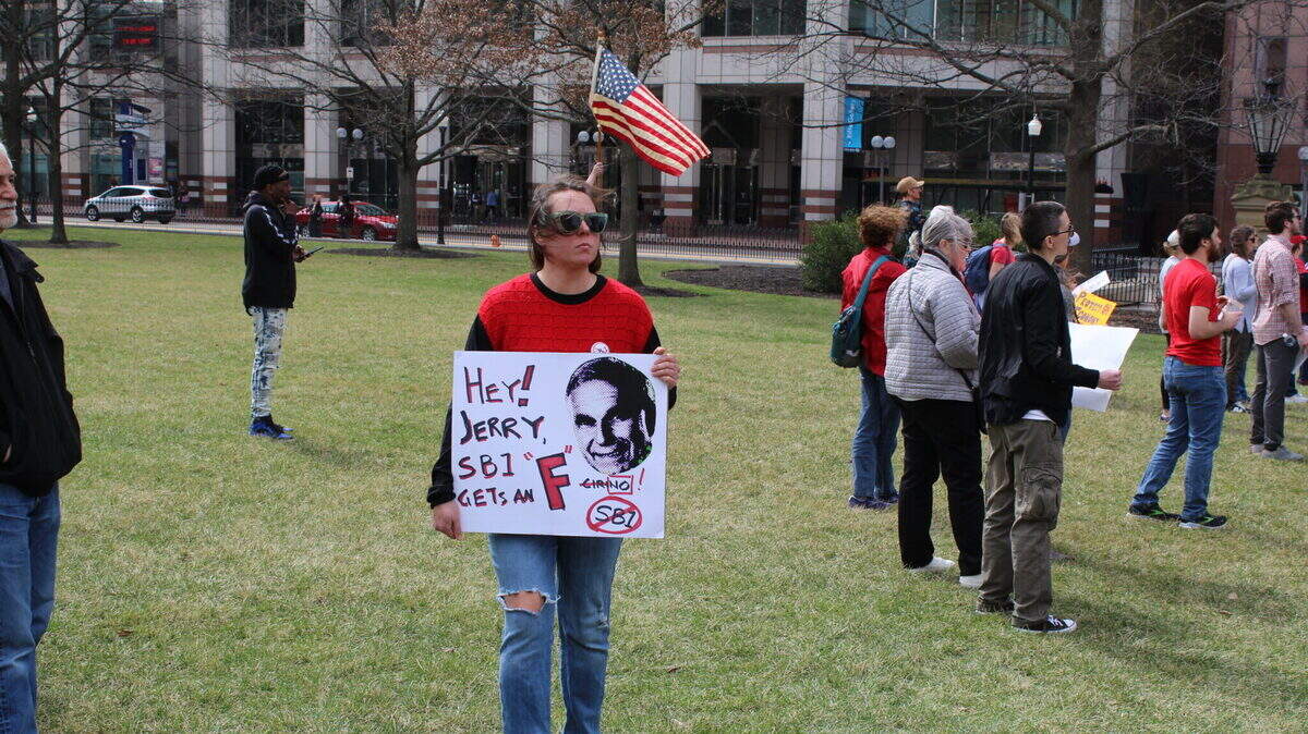 Ohio college students and protesters rally at the Statehouse against Senate Bill 1, a higher education overhaul that bans diversity efforts and faculty strikes, and sets rules around classroom discussion, among other things.