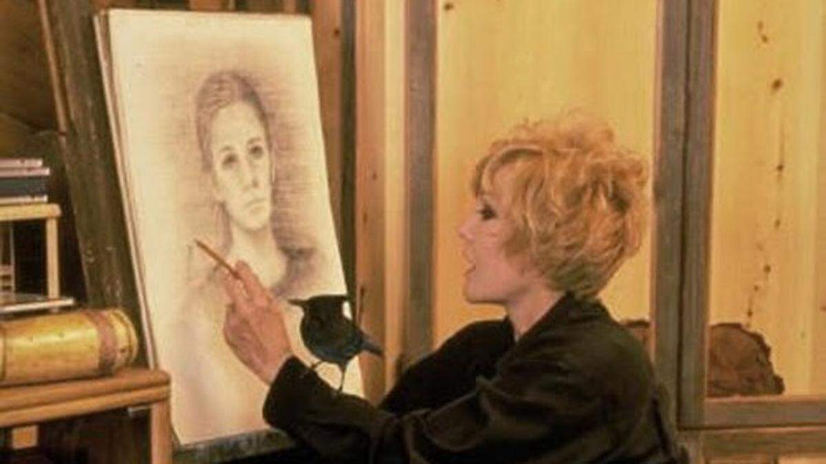 Kim Novak painting with her pet Steller’s Jay, Shadow.