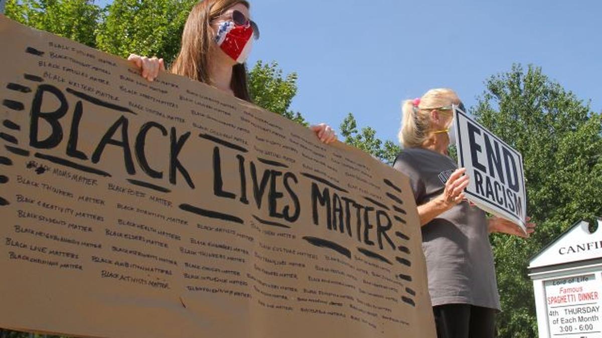 Protesters stand on Main Street in Canfield for a Black Lives Matter rally Sunday morning. (William D. Lewis | Mahoning Matters)