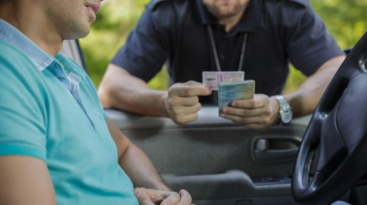 Young male driver stopped by law enforcement.