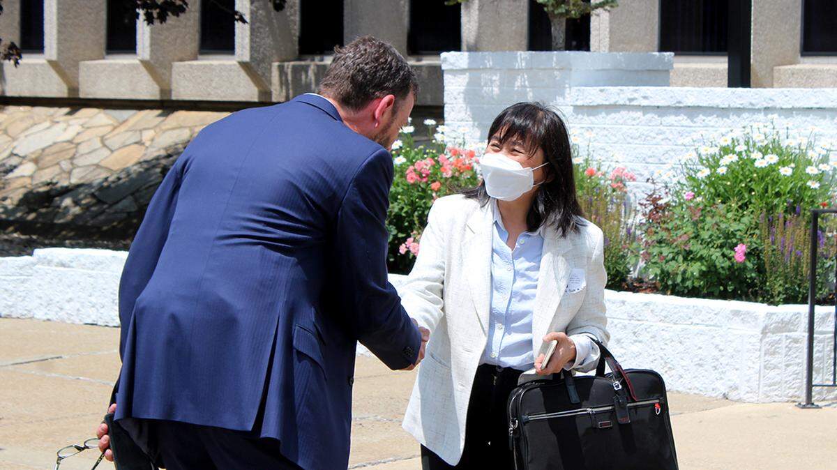 State Sen. Mike Rulli of Salem, R-33rd, shakes hands with Dr. Christina Yee-ru Liu, a member of Foxconn Technology Group’s board of directors, during an open house on Wednesday, June 22, 2022, at Foxconn’s recently acquired automotive assembly plant in Lordstown, Ohio.