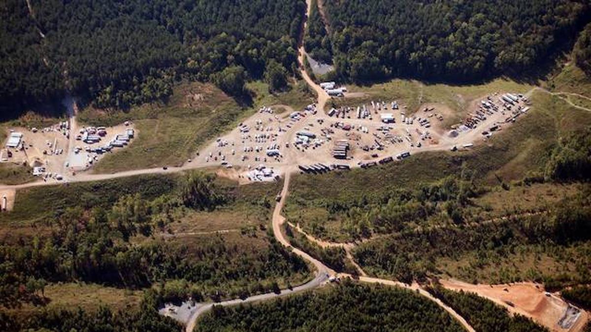 In this Sept. 20, 2016, file photo, vehicles are seen near Colonial Pipeline in Helena, Ala. The company, which transports fuel along the East Coast, said it had to pause operations because it was the victim of a cyberattack. (Brynn Anderson |AP Photo, File)