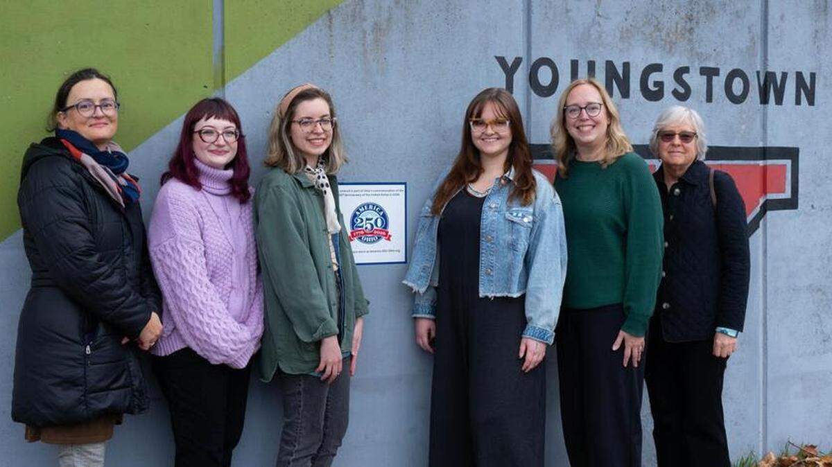 Dragana Crnjak, professor of art at Youngstown State University; Jayme McKay ’23, BFA in Interdisciplinary Studio Arts; Chloe Miklos ’20, BA in Multimedia Communication with a minor in Studio Art; Rachel Hritz ’22, BFA in Studio Art with a focus in painting; Joy Christiansen Erb, chair of the Department of Art; and Karen Schubert, director of Lit Youngstown and partner in the first phase of the mural.