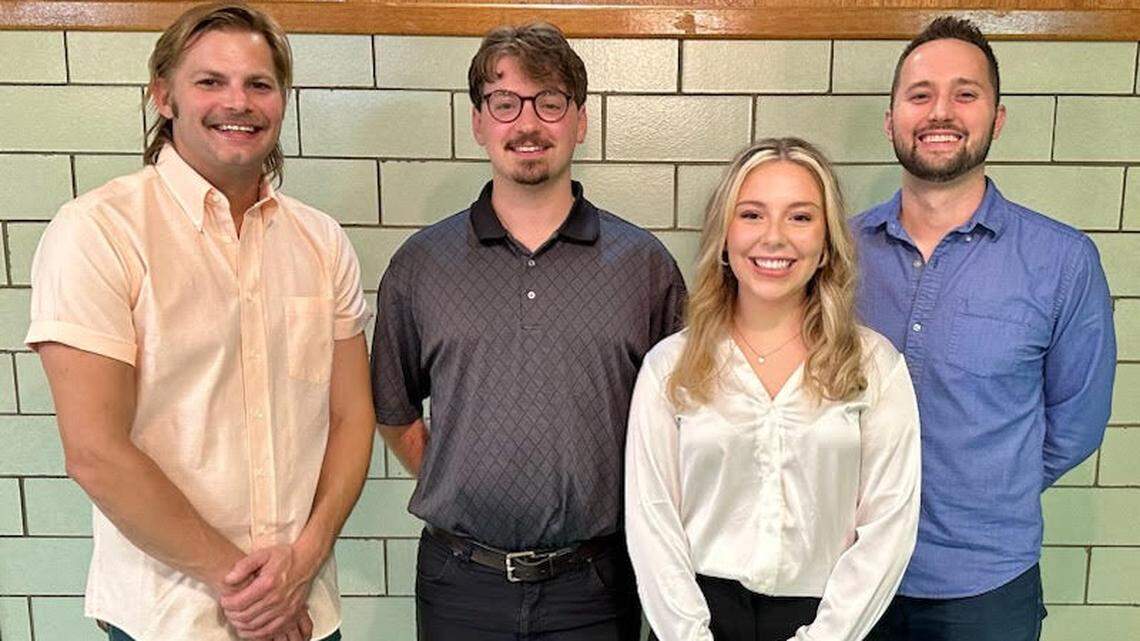 (left to right) Adam Keck, president of Modern Methods Brewing; scholarship winners Andrew Kakosiak and Caitlin Hillard; David Slanina, Simply Slavic treasurer.