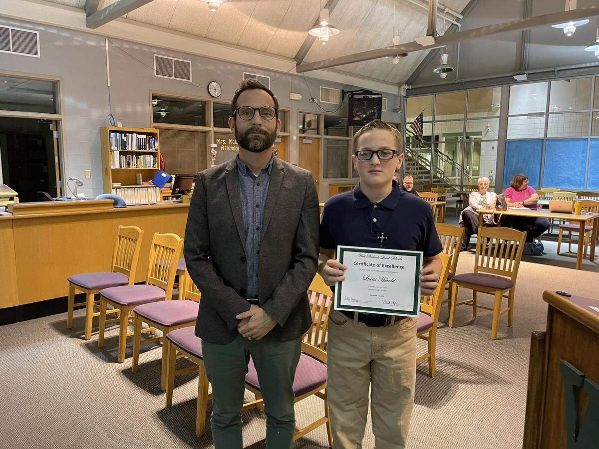 West Branch Middle School Principal Jayson Yeagley with seventh-grade student Lucas Herold, the honored student for December.