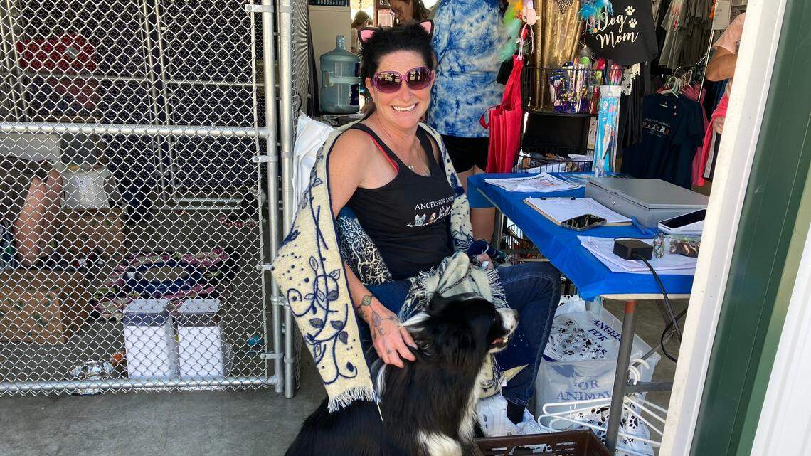 Lee Frazzini poses with a dog at the Canfield Fair.