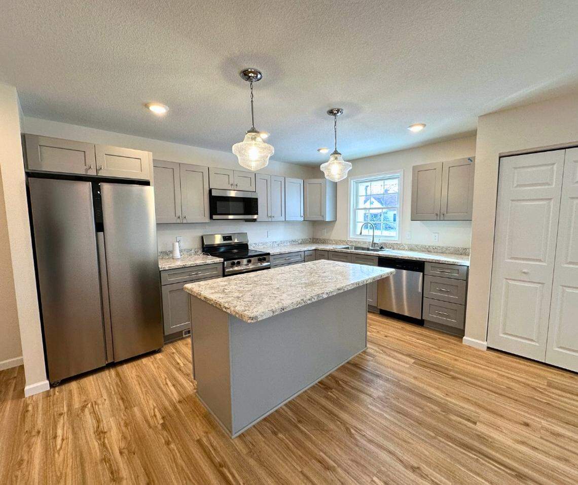 Both interior and exterior photos available to view on YNDC’s website, including the open-concept kitchen and living room areas.