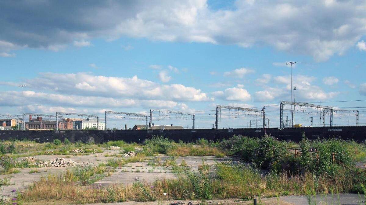 A large unused urban brownfield site is awaiting development.