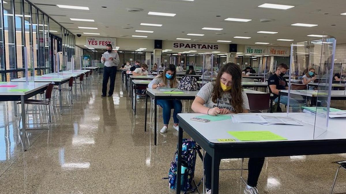 Some High School students at BHS meet for homeroom in the morning in the cafeteria, which has new plexiglass dividers at every table. (Photo provided)