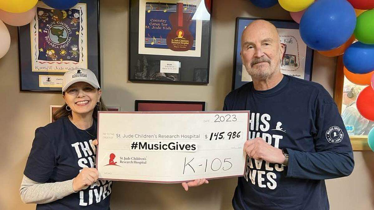 K105 Morning radio’s Mary Ann Graff and Doug James poses with a check to help St. Jude Children’s Research Hospital. Listeners and friends in the community are remembering Doug James, a longtime morning co-host for Cumulus Youngstown’s Country station K105 (WQXK-FM), who died on Jan. 8 at 71 years old.