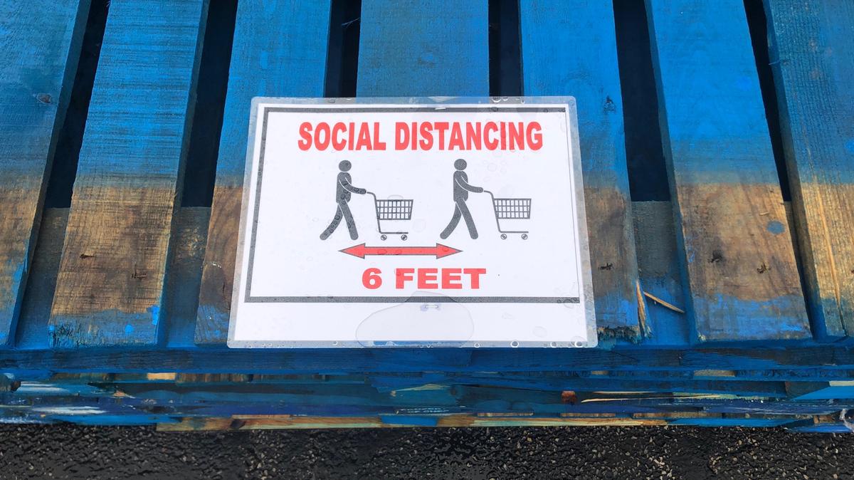 Social distancing instructions at a store.