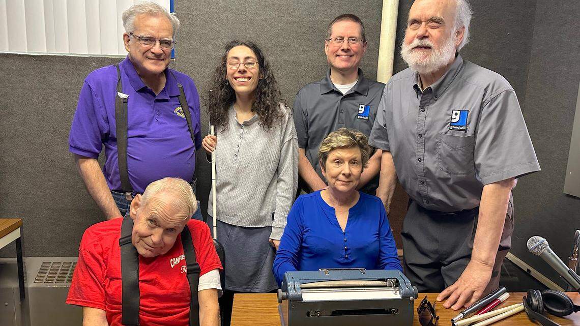 Patty Poorman sits and tests out her new Perkins Brailler thanks to donations from the Melvin Jones Foundation, Canfield and Boardman Lions Clubs, and Youngstown Area Goodwill Industries, Inc. Sitting with her is Ted Filmer, Canfield Lions Club member. Standing are, from left, Andy Dzuracky, Melvin Jones Foundation promoter, Joy Mistovich, Boardman Lions Club and Goodwill board member, Mike Muder, Youngstown Radio Reading Service Manager, and Mike Bosela, former Director of YRRS.