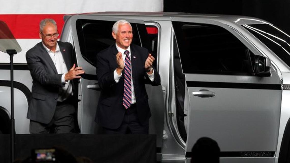 Vice President Mike Pence, right, and Lordstown Motors Corp. CEO Steve Burns exit an Endurance pickup truck Thursday as the company unveiled its new all-electric vehicle at the Lordstown plant. (William D. Lewis | Mahoning Matters)