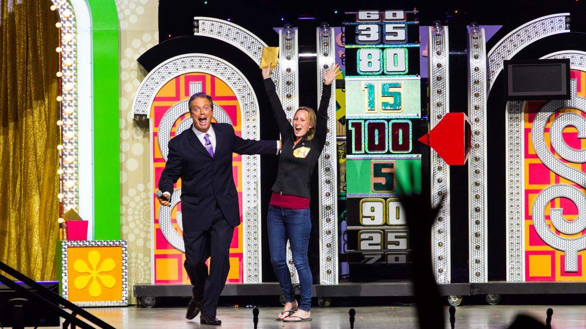 Todd Newton with a contestant during the “Price is Right” traveling show