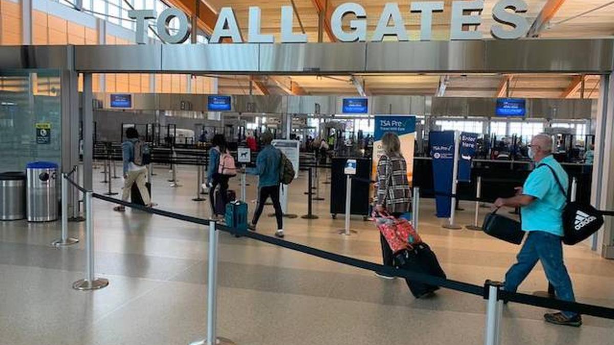 Passengers head for the TSA security checkpoint in Terminal 2 at Raleigh-Durham International Airport on Monday (May 24, 2021). 