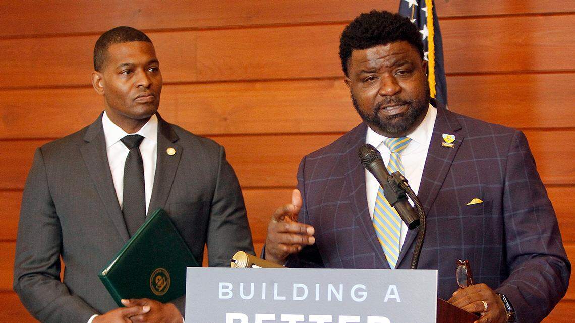 Youngstown Mayor Jamael Tito Brown (right) speaks with reporters on Tuesday, April 19, 2022, at the Michael Kusalaba Library along Mahoning Avenue in Youngstown, following a tour of homes along Eddie Street that are marked for lead pipe removal using federal infrastructure dollars. Alongside is U.S. EPA Administrator Michael Regan.