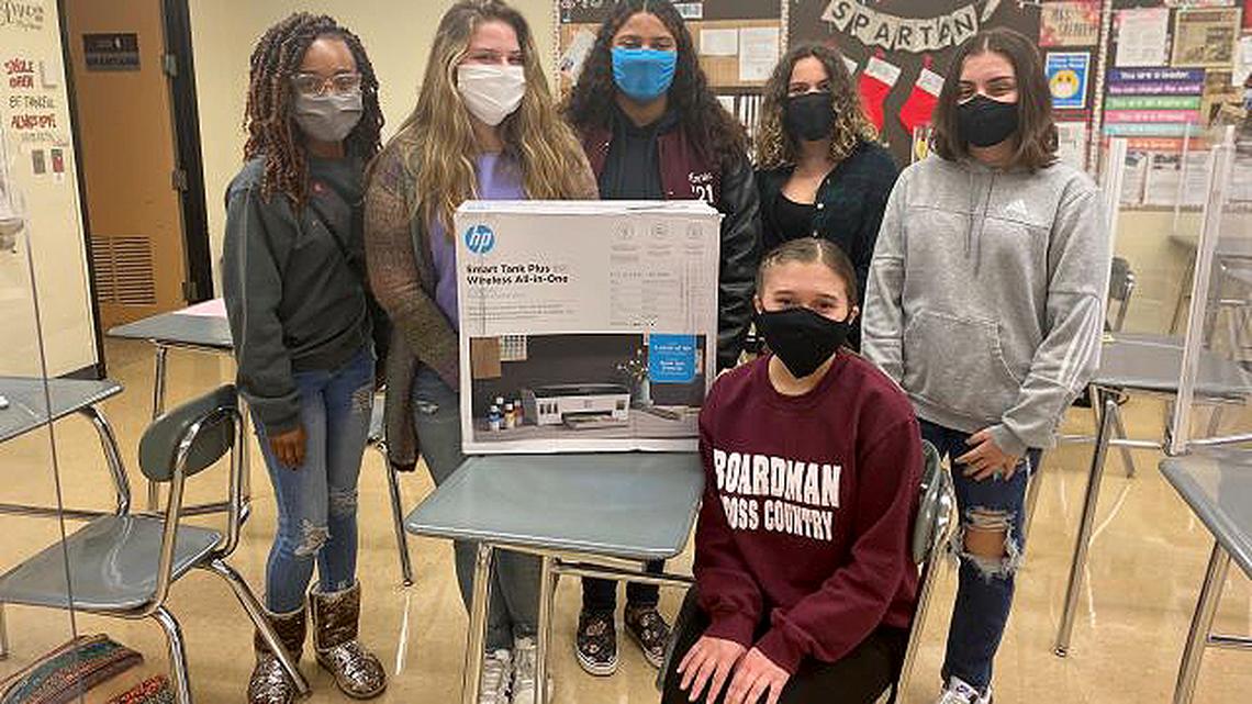 Staff members of The Boardman Bugle, Boardman High School’s student-run newspaper, display the HP printer that was purchased through a Boardman Schools Fund for Educational Excellence teacher grant. (Contributed photo)