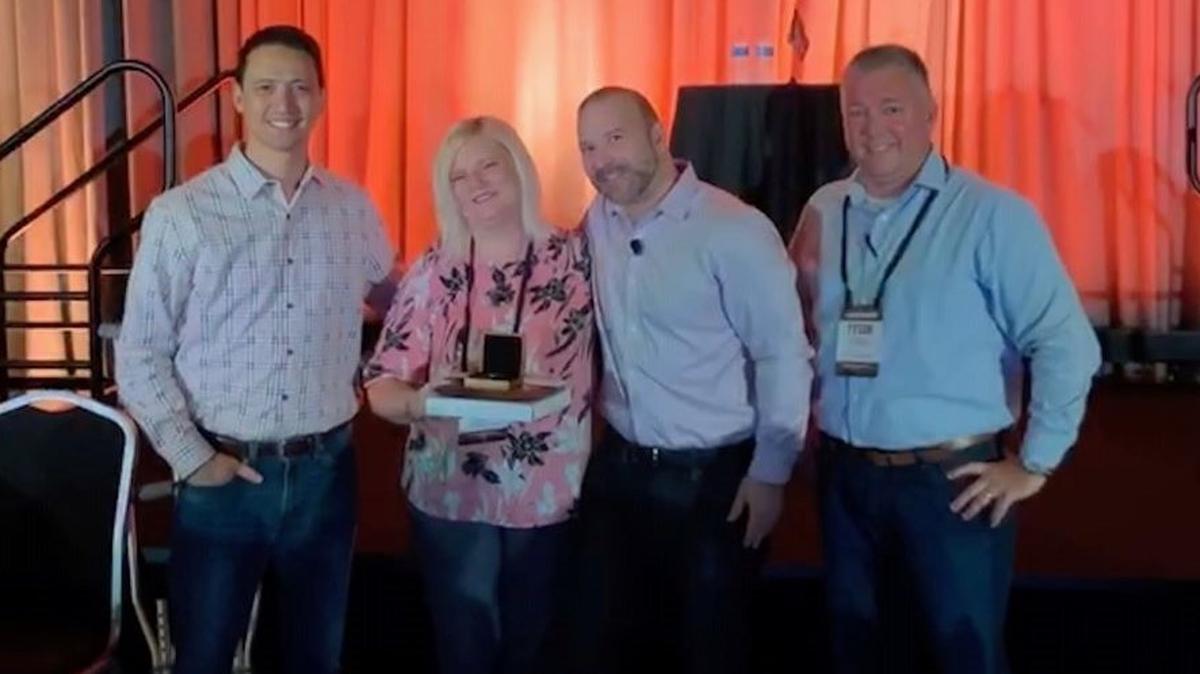Keri Donchess, second from left, a service manager at the LongHorn Steakhouse in Boardman, recently received the company's Manager of the Year award.