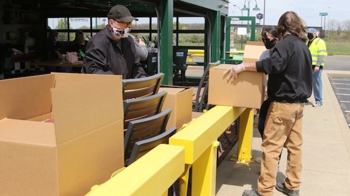 Sunday afternoon Austintown Quaker Steak and Lube was where over 200 boxes of food were stocked with food and supplies sponsored by the Chicken Coupe Cruisers - It was a drive thru location in Austintown

Boxes are lined up awaiting people to stop by