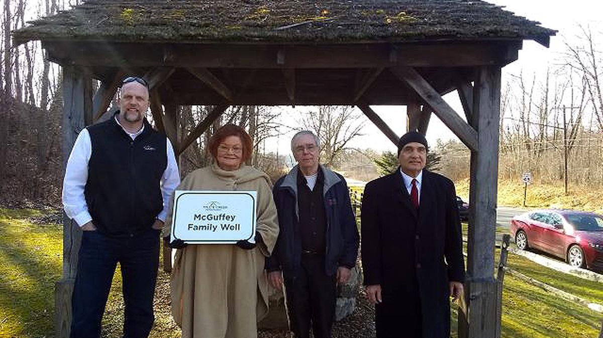 The McGuffey Family Well has a new sign. At the dedication were (left to right) Aaron Young, Mill Creek Metroparks Director; Shirley Eckley, William Holmes McGuffey Historical Society president; Tom Eckley, WHMHS vice president and treasurer;  and Richard S. Scarsella, WHMHS chairman of the board of directors. 