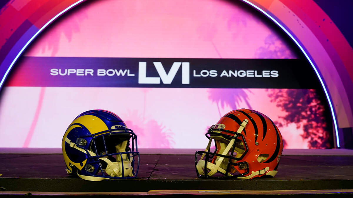Los Angeles Rams and Cincinnati Bengals helmets are placed on a stage inside the NFL Experience, an interactive fan show, at the Los Angeles Convention Center in Los Angeles on Feb. 4. The Rams will play the Bengals in Super Bowl LVI on Sunday in Inglewood, California.