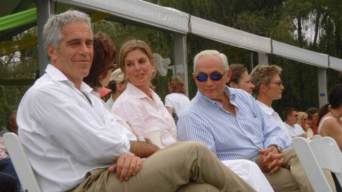 A photo of Jeffery Epstein, an unknown woman, Abigail Wexner, and Les Wexner in the Epstein files.