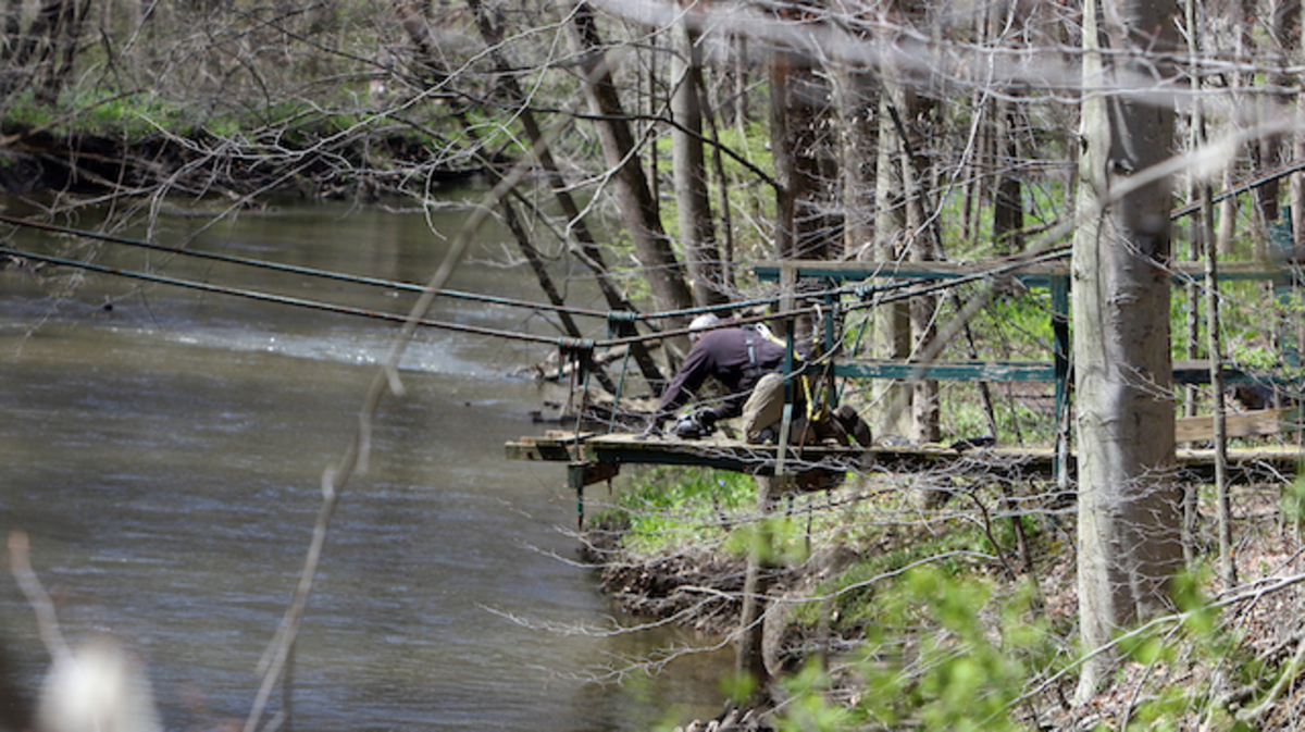 A worker for Murphy Contracting dismantles the old bridge

the rehabilitation and reconstruction of Mauthe Park Bridge in Poland Woods is to be completed in mid-May, he said.
Murphy Contracting is handling the project, which has a $86,400 pricetag.
The bridge has been closed since July 2018, In 1956, the bridge was built and dedicated for J.L. âPeteâ Mauthe, former president of Youngstown Sheet and Tube. It stretches over Yellow Creek.