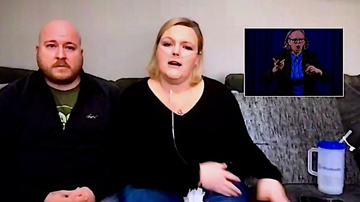 Stephanie Marshall, a respiratory therapist at OhioHealth Grant Medical Center in Columbus, and her husband Ryan during the state's coronavirus update on Tuesday, Nov. 24, 2020.