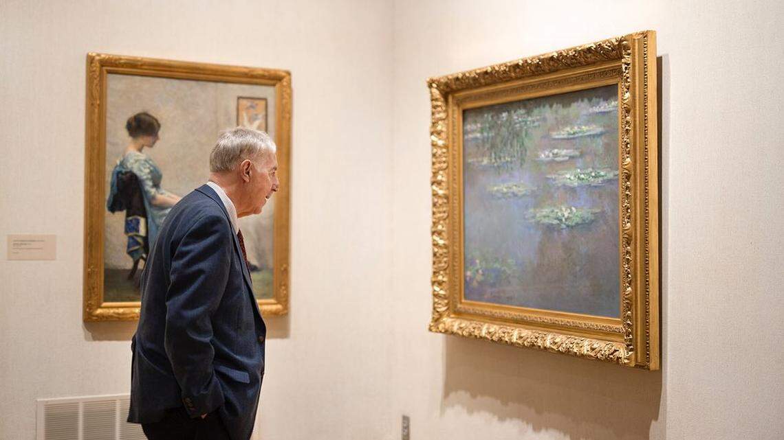 Lou Zona, executive director of the Butler Institute of American Art views Monet’s “Nymphéas” painting.