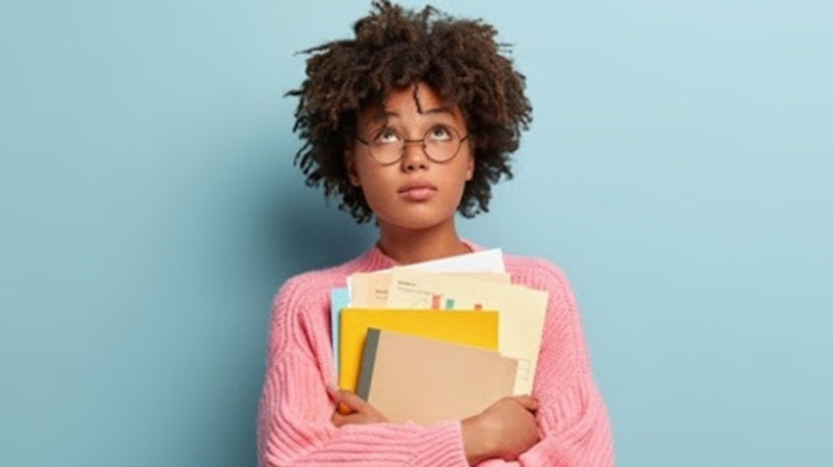 Black women carry roughly 20% more student debt than their white counterparts. (AdobeStock)