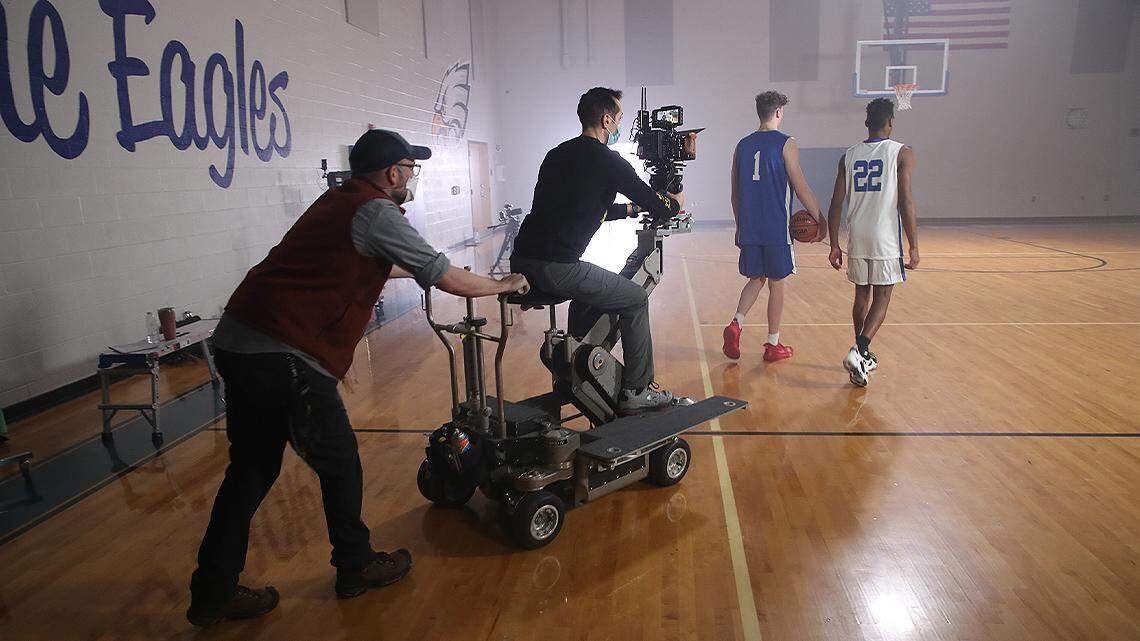 Ronnie Leonard (1) of Struthers High School and Kaden Lowe (22) of Hubbard High School are featured in a Werner Co. commercial that will air during the 2022 NCAA Basketball Tournament. The commercial was created by Youngstown-based agencies Cinemanix and Clever, and some of the filming took place at Hubbard High School. (Photo provided)