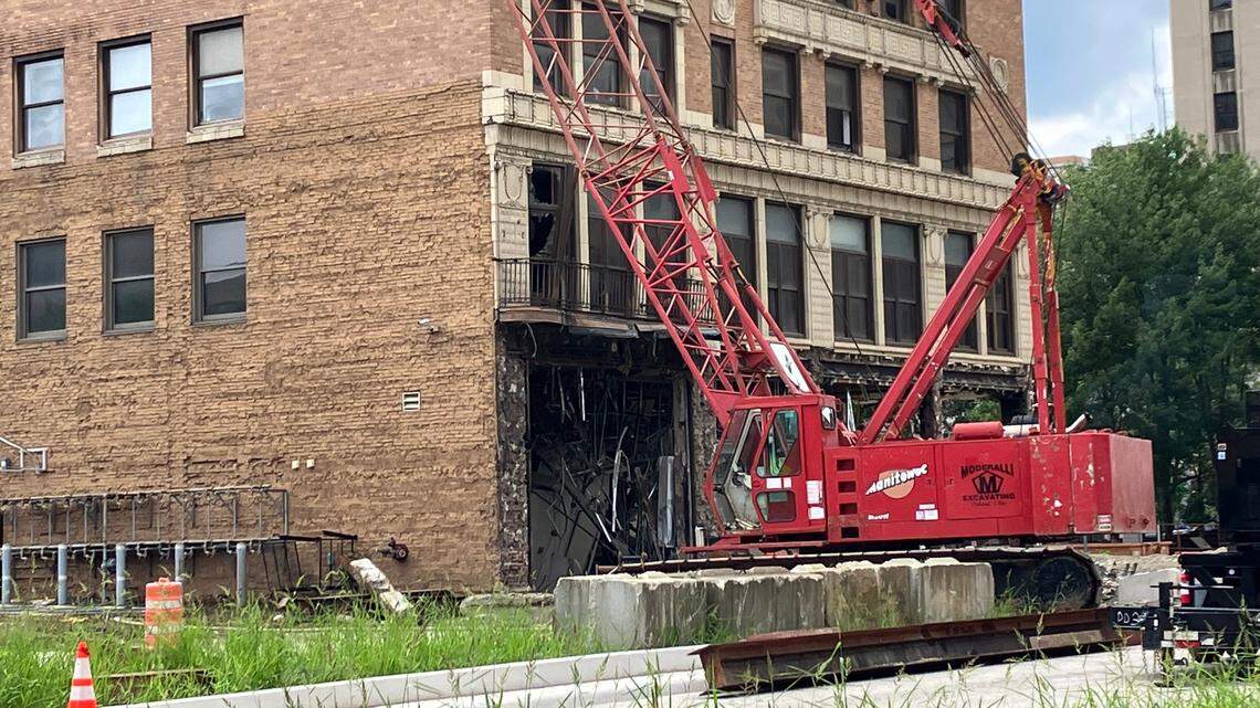 A crane sits in front of the Realty Building Thursday afternoon