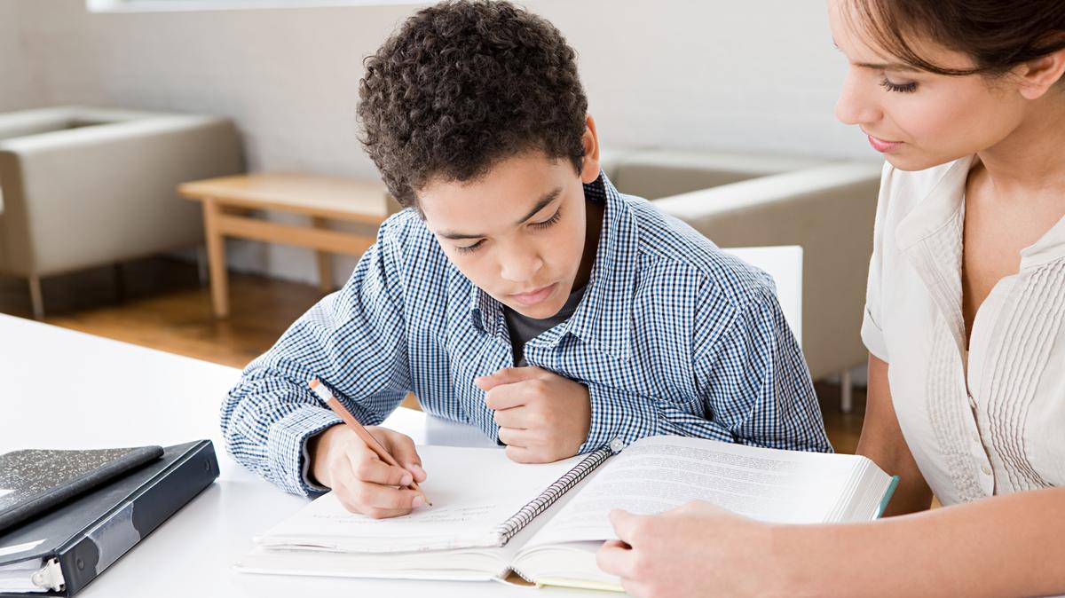 Elementary school student completing classwork. Photo/Getty